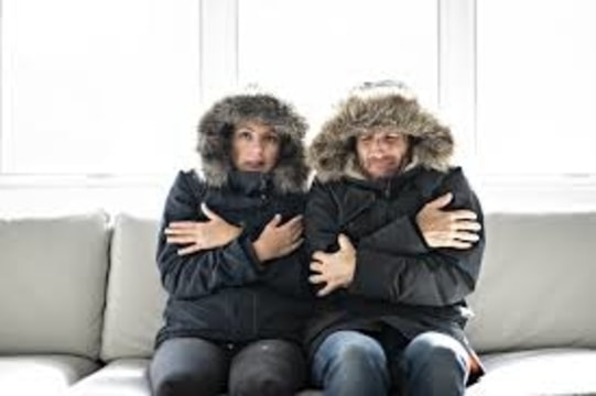 couple cold in their home. 
