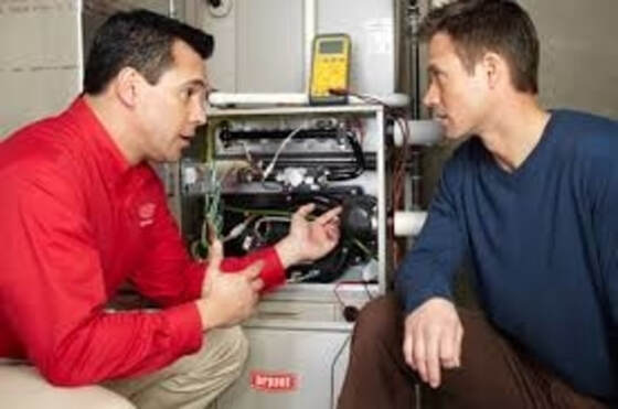furnace technician consulting customer
